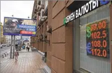  ?? ALEXANDER ZEMLIANICH­ENKO AP ?? Russia’s central bank hiked its key rate 3.5 percentage points to 12 percent in an emergency move to strengthen the ruble.