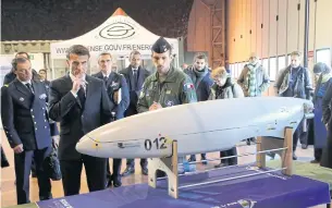  ?? ?? BROADER HORIZONS: French President Emmanuel Macron watches a military drone at Mont-deMarsan air base, southweste­rn France, before delivering his New Year address to the French Army on Friday.