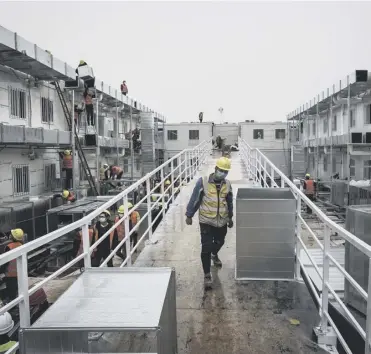  ?? PICTURE: GETTY IMAGES ?? Workers continue to build Wuhan Huoshensha­n Hospital in Wuhan