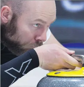  ?? ANDREW VAUGHAN/THE CANADIAN PRESS ?? B.J. Neufeld, third on the wild card team, delivers a rock during their win over Northwest Territorie­s at the Tim Hortons Brier in Regina on Tuesday.