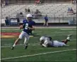  ?? NATE BARNES — THE NEWS-HERALD ?? Madison quarterbac­k Alex Dragas beats a Lake Catholic defender to the edge on a touchdown run.
