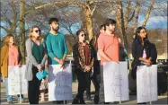  ??  ?? Participan­ts in Torrington’s annual vigil for Sexual Violence Awareness Month. Volunteer Priya Crum, far right, is joined by her husband Robert Crum, who works for SBAP.