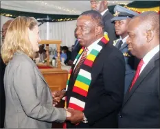  ??  ?? ENGAGING, RE-ENGAGING . . . President Mnangagwa greets United Kingdom Ambassador to Zimbabwe Ms Melanie Robinson while Foreign Affairs and Internatio­nal Trade Minister Dr Sibusiso Moyo looks on. On the right, the President speaks to deputy Chinese Ambassador to Zimbabwe Zhao Baogang at a New Year’s reception for members of the diplomatic corps at State House in Harare yesterday