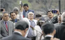  ?? RALPH BARRERA / AMERICAN-STATESMAN ?? Luis and Lucy Aranda from Dallas (center) join in prayer with Pastors and Evangelica­ls from across Texas on the south steps of the Capitol during a “Prayer Rally for Immigrants” on Tuesday. The gathering included state lawmakers.