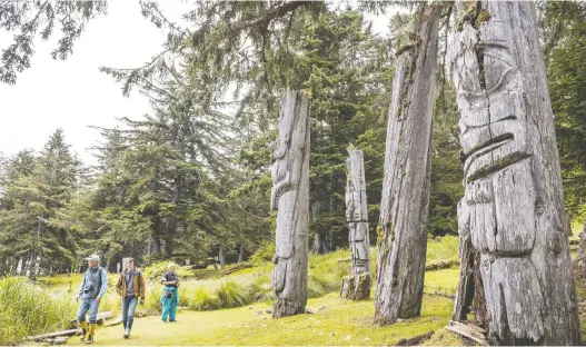  ?? SCOTT MUNN/ PARKS CANADA ?? Tourists are said to walk among the spirits of the Haida on the British Columbia island of Sgang Gwaay in Gwaii Haanas National Park Reserve.