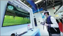  ?? DU JIANPO / FOR CHINA DAILY ?? A man plays a 5G virtual reality soccer game during the Global Digital Economy Conference 2023 in Beijing.