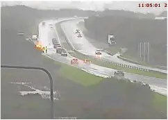  ?? PICS: TRAFFIC WALES/ LOWRI FON WILLIAMS ?? ■ Heavy rain hampered travel across the region late last week. Above, flooding issues on the A55 across Anglesey; right, part of Bangor Tesco car park flooded.