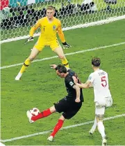  ?? /Reuters ?? Now for France: Croatia’s Mario Mandzukic scores their second goal in the 109th minute.