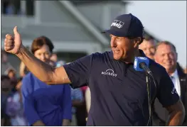  ?? DAVID J. PHILLIP — THE ASSOCIATED PRESS, FILE ?? Phil Mickelson speaks after winning last year's PGA Championsh­ip in Kiawah Island, S.C. Mickelson on Friday withdrew from competing at this year's PGA Championsh­ip.