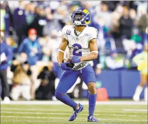  ?? Steph Chambers Getty Images ?? ROBERT WOODS caught 12 passes in the Rams’ victory against the Seahawks that also featured solid ground games from the combinatio­n of Darrell Henderson and Sony Michel.