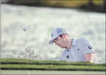  ?? Wilfredo Lee Associated Press ?? LUKE LIST hits out of a bunker on the 18th during the third round of the Honda Classic. He leads the tournament.