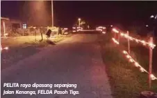  ??  ?? PELITA raya dipasang sepanjang Jalan Kenanga, FELDA Pasoh Tiga.