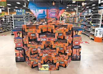  ?? ROBERT F. BUKATY/AP ?? Halloween candy is displayed at a store Wednesday in Freeport, Maine. Earlier Halloween displays likely helped boost sales.