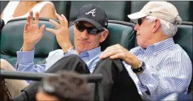  ?? HYOSUB SHIN/AJC 2016 ?? Liberty Media CEO Greg Maffei (left), seen in 2016 with Braves Chairman Terry Mcguirk, said Friday he expects to have fans in Truist Park to some extent this year.