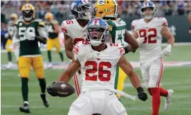  ?? Photograph: Tom Jenkins/The Guardian ?? Saquon Barkley celebrates during the New York Giants’ victory over the Green Bay Packers in London earlier this season.