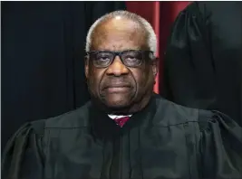  ?? ERIN SCHAFF — THE NEW YORK TIMES ?? Justice Clarence Thomas sits during a group photo at the Supreme Court in Washington.