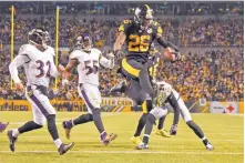  ?? DON WRIGHT/AP ?? The Pittsburgh Steelers have put the franchise tag on star running back Le’Veon Bell (26) for a second straight spring, putting his longterm status with the club up in the air.