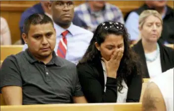  ?? JIM SLOSIAREK/THE GAZETTE VIA AP, POOL ?? People in the courtroom reacts after Cristhian Bahena Rivera’s initial court appearance, Wednesday at the Poweshiek County Courthouse in Montezuma, Iowa. Rivera is charged with first-degree murder in the death of Mollie Tibbetts, who disappeare­d July 18 from Brooklyn, Iowa.