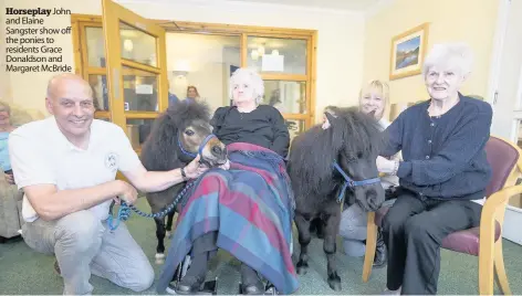  ??  ?? Horseplay John and Elaine Sangster show off the ponies to residents Grace Donaldson and Margaret McBride