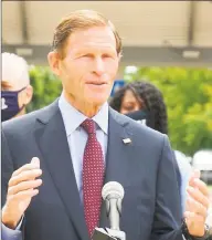  ?? Contribute­d photo ?? U.S. Sen. Richard Blumenthal, standing with employees from the Associatio­n of Commuter Rail Employees, called for further federal funding for Metro-North Wednesday in West Haven.
