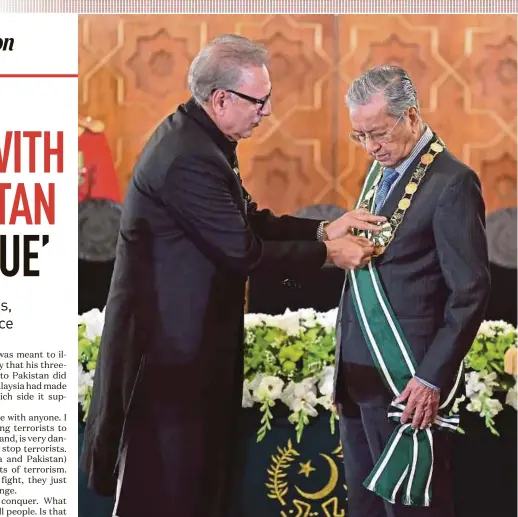  ?? BERNAMA PIC ?? Prime Minister Tun Dr Mahathir Mohamad being conferred Pakistan’s highest civilian award, the Nishan-e-Pakistan, by Pakistani President Dr Arif Alvi, in Islamabad on Friday.