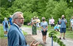  ??  ?? Left: Keith Kaiser, executive director of the Pittsburgh Botanic Garden, addresses visitors and staff at the opening of the Garden of the Five Senses on July 30. (Pittsburgh Post-Gazette)