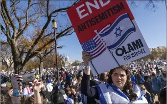  ?? JACQUELYN MARTIN, FILE — THE ASSOCIATED PRESS ?? A woman holds a sign saying, “end antisemiti­sm” while attending a March for Israel rally Tuesday, Nov. 14, 2023, on the National Mall in Washington.