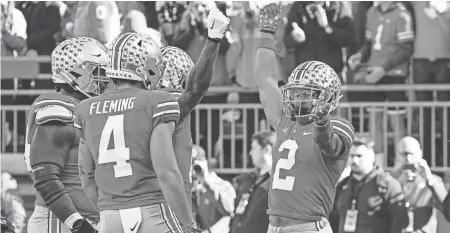  ?? ADAM CAIRNS/COLUMBUS DISPATCH ?? Ohio State receiver Emeka Egbuka celebrates a touchdown against Michigan.