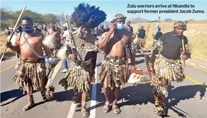  ??  ?? Zulu warriors arrive at Nkandla to support former president Jacob Zuma.