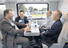  ?? TAIMY ALVAREZ/STAFF PHOTOGRAPH­ER ?? Brightline’s Jose M. Gonzalez and Fort Lauderdale Commission­ers Romney Rogers and Bruce Roberts and Broward County Mayor Beam Furr ride the train on Friday.