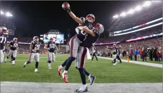  ?? JIM ROGASH, GETTY IMAGES ?? Danny Amendola, left, of the New England Patriots celebrates one of his two fourth-quarter TDs in 24-20 win Sunday.