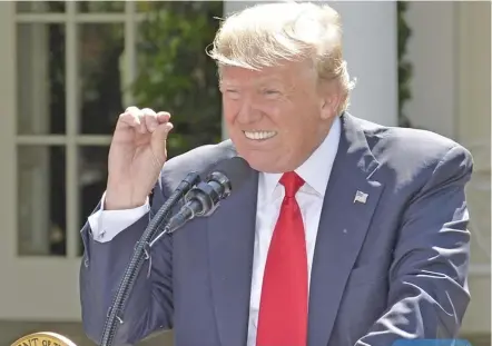  ?? Photo: Xinhua ?? US President Donald Trump gestures as he delivers a speech at the White House in Washington DC, on June 1, 2017. Mr Trump said on Thursday that he had decided to pull the United States out of the Paris Agreement, a landmark global pact to fight climate...