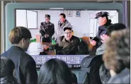  ?? AP/AHN YOUNG-JOON ?? People watch a TV news program showing an image, published in North Korea’s Rodong Sinmun newspaper, of North Korean leader Kim Jong Un at the country’s Sohae launch site, at Seoul Railway station in Seoul, South Korea, on Sunday.