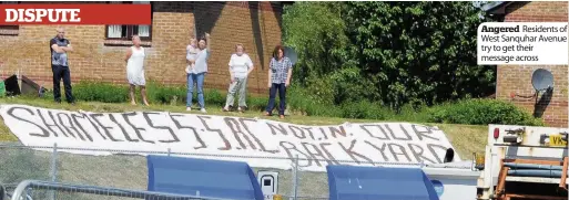  ??  ?? Angered Residents of West Sanquhar Avenue try to get their message across