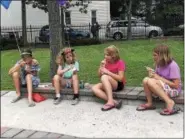  ?? MONICA SAGER — DIGITAL FIRST MEDIA ?? Kids enjoy free water ice at National Night Out at the Washington and Chestnut Street Park.