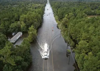  ?? Jon Shapley / Staff photograph­er ?? Mauricevil­le was still underwater Friday from the remnants of Tropical Storm Imelda.