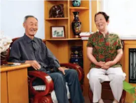  ?? by Fang Shuo ?? Zhao Zhenyu (left) and his wife Bai Wenjuan, both in their 70s, are retired workers from the Saihanba forest farm. In 1962, a total of 127 graduates like them from across China came to rebuild the forest.