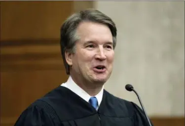  ?? J. SCOTT APPLEWHITE — THE ASSOCIATED PRESS ?? In this photo. President Donald Trump’s Supreme Court nominee, Judge Brett Kavanaugh, officiates at the swearing-in of Judge Britt Grant to take a seat on the U.S. Court of Appeals for the Eleventh Circuit in Atlanta at the U.S. District Courthouse in Washington. America is about to get its first extended look at Supreme Court nominee Brett Kavanaugh in his confirmati­on hearing before the Senate Judiciary Committee.