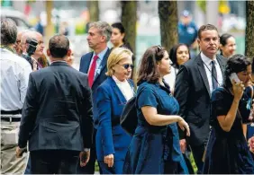  ?? PHOTO BY ERIC THAYER/THE NEW YORK TIMES ?? Hillary Clinton attends a ceremony to mark the 15th anniversar­y of the 9/11 terrorist attacks at the National September 11 Memorial & Museum in New York on Sunday. Clinton abruptly left the ceremony before it concluded because she became “overheated,”...