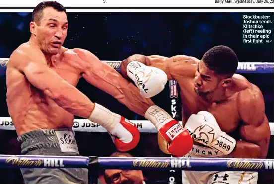  ?? AFP ?? Blockbuste­r: Joshua sends Klitschko (left) reeling in their epic first fight