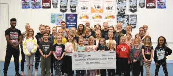  ??  ?? Members of the Moose Jaw Kinsmen Cobra Cheerleadi­ng Club gather for a group photo with Kinsmen members Cory Olafson and Dave Stevenson after receiving the first sponsorshi­p installmen­t of $5,000 in May 2019. (photo by Randy Palmer)