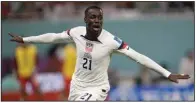  ?? (AP/Darko Vojinovic) ?? Tim Weah of the United States celebrates after scoring a goal in the first half Monday. Wales tied the score with a penalty kick in the second half.