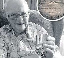  ?? Dennis Booth, above, with his grandad’s Best Mare and Foal Trophy from 1915; a football medal, inset, won by a Cpl Butler in the same year; one of the cards sent home from the depot, left ??