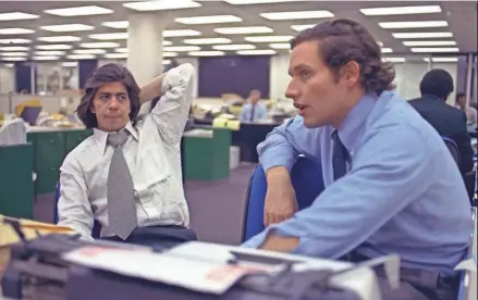  ?? AP ?? Reporters Bob Woodward, right, and Carl Bernstein, whose reporting of the Watergate case won a Pulitzer Prize, sit in the newsroom of The Washington Post in 1973.