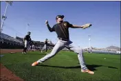  ?? DARRYL WEBB — BAY AREA NEWS GROUP ?? San Francisco Giants pitcher Logan Webb warms up on the first day as pitchers and catchers report at Scottsdale Stadium, Thursday, in Scottsdale, Ariz.