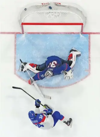  ?? MATT SLOCUM/AP ?? Slovakia’s Peter Cehlarik scores the winning goal against U.S. goaltender Strauss Mann during the shootout Wednesday.