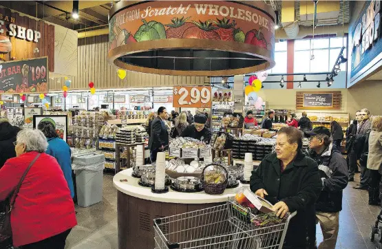  ?? BRIAN THOMPSON/FILES ?? Ottawa-based Farm Boy’s newer stores have a restaurant-inspired design with seating areas and chefs cooking inside the store. Such so-called “grocerants” are becoming more ubiquitous as the fastest-growing meal segment last year was ready-prepared meals.