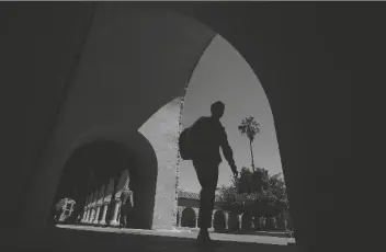  ?? ASSOCIATED PRESS ?? IN THIS APRIL 9, 2019, FILE PHOTO, Stanford, Calif. pedestrian­s walk on the campus at Stanford University in