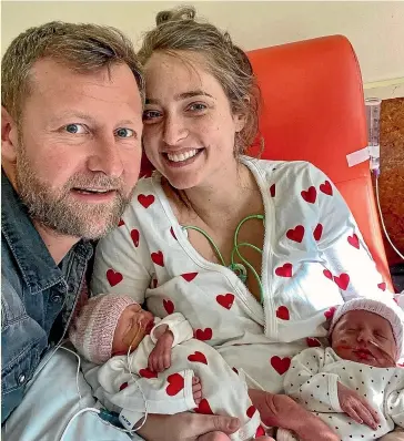  ?? ?? Andrew Gutsell and Scarlett Henocq at Timaru Hospital with their twin girls after a rushed trip, with police escort, from Twizel for the birth.