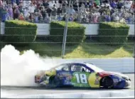  ?? DERIK HAMILTON - THE ASSOCIATED PRESS ?? Kyle Busch celebrates with a burnout after winning a NASCAR Cup Series auto race, Sunday, July 29, 2018, in Long Pond, Pa.